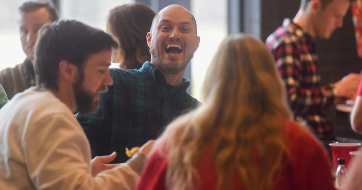 smiling coworking in a crowd