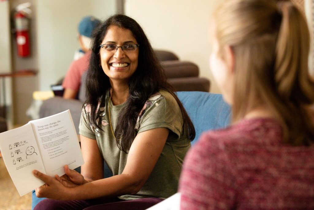 SEPeers discussing a book at book club