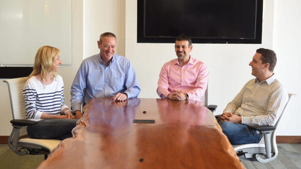 SEP leadership team sitting at a board room table