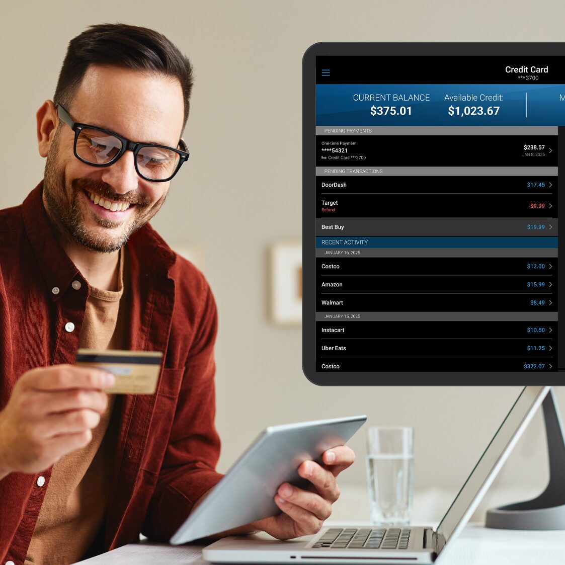 man holding credit card smiling with overlay of banking info on a screen